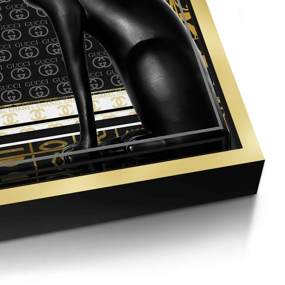 2Close-up of black canvas print with gold reflective accent on frame