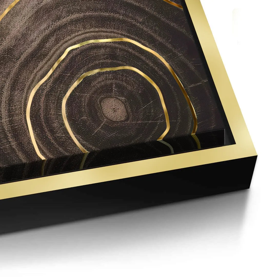 2Close-up detail of the gold picture frame edge around the abstract wood canvas art.