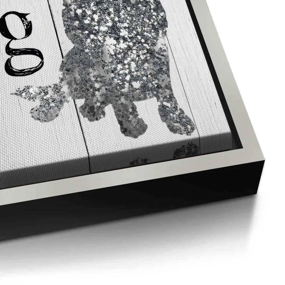 2Close-up detail of the silver picture frame edge around the love and a dog canvas art.