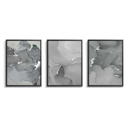 Three-piece abstract grey canvas art set with black frames
