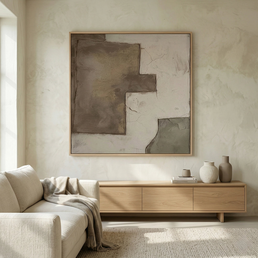 Sculptural 'Broken Plaster' coffee table with a raw-edged stone top and a distressed mineral base, a unique handcrafted furniture piece for high-end UAE interiors