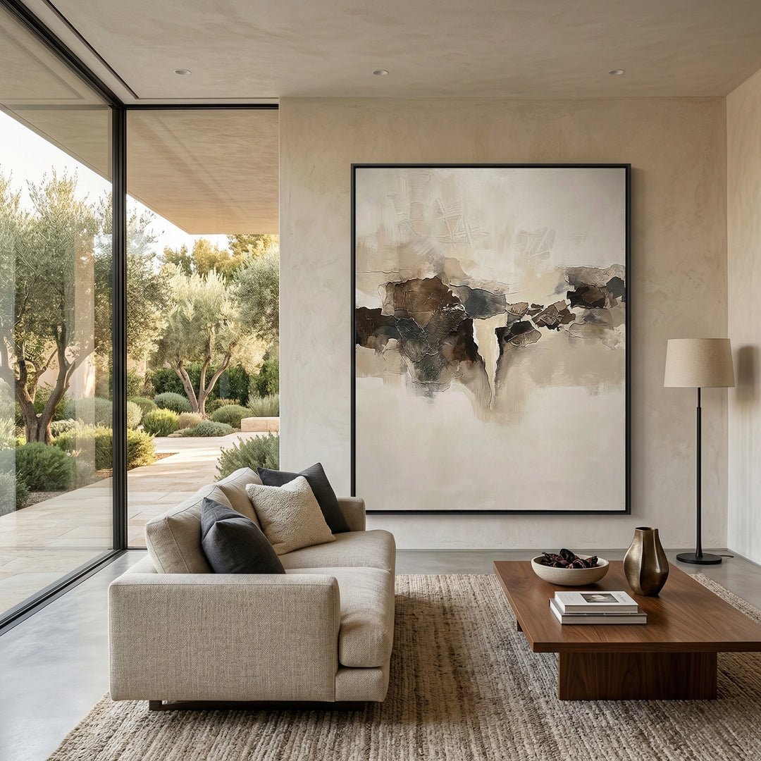 Sculptural 'Fragmented Calm' coffee table with a raw-edged travertine top and geometric base, a unique handcrafted furniture piece for high-end UAE interiors