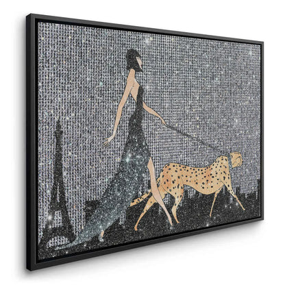 Angled canvas print of woman walking cheetah in Paris, featuring a black frame.