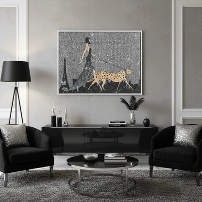 Modern chic living room with black furniture and large woman and cheetah silver framed canvas art.