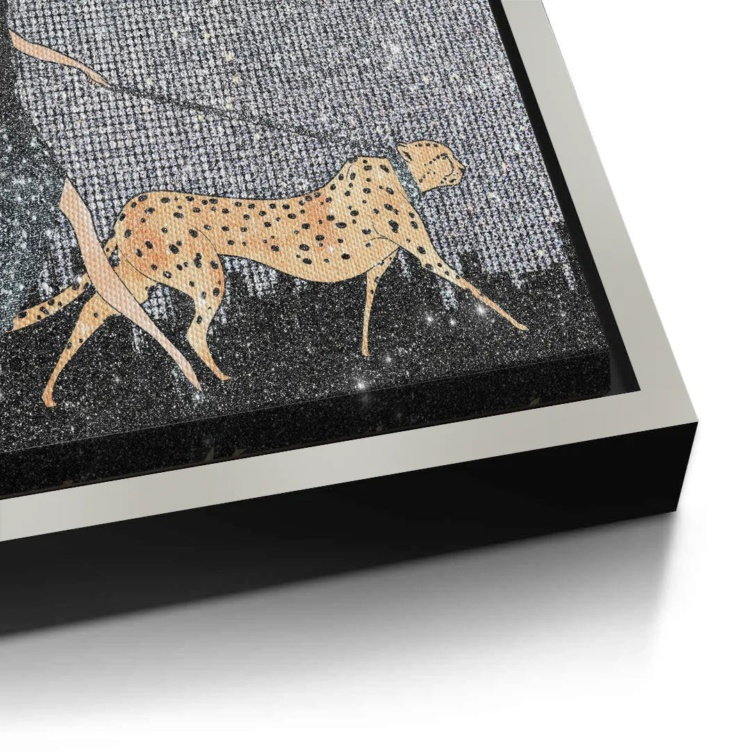 2Close-up of the cheetah on the canvas print, showcasing the silver  frame edge.