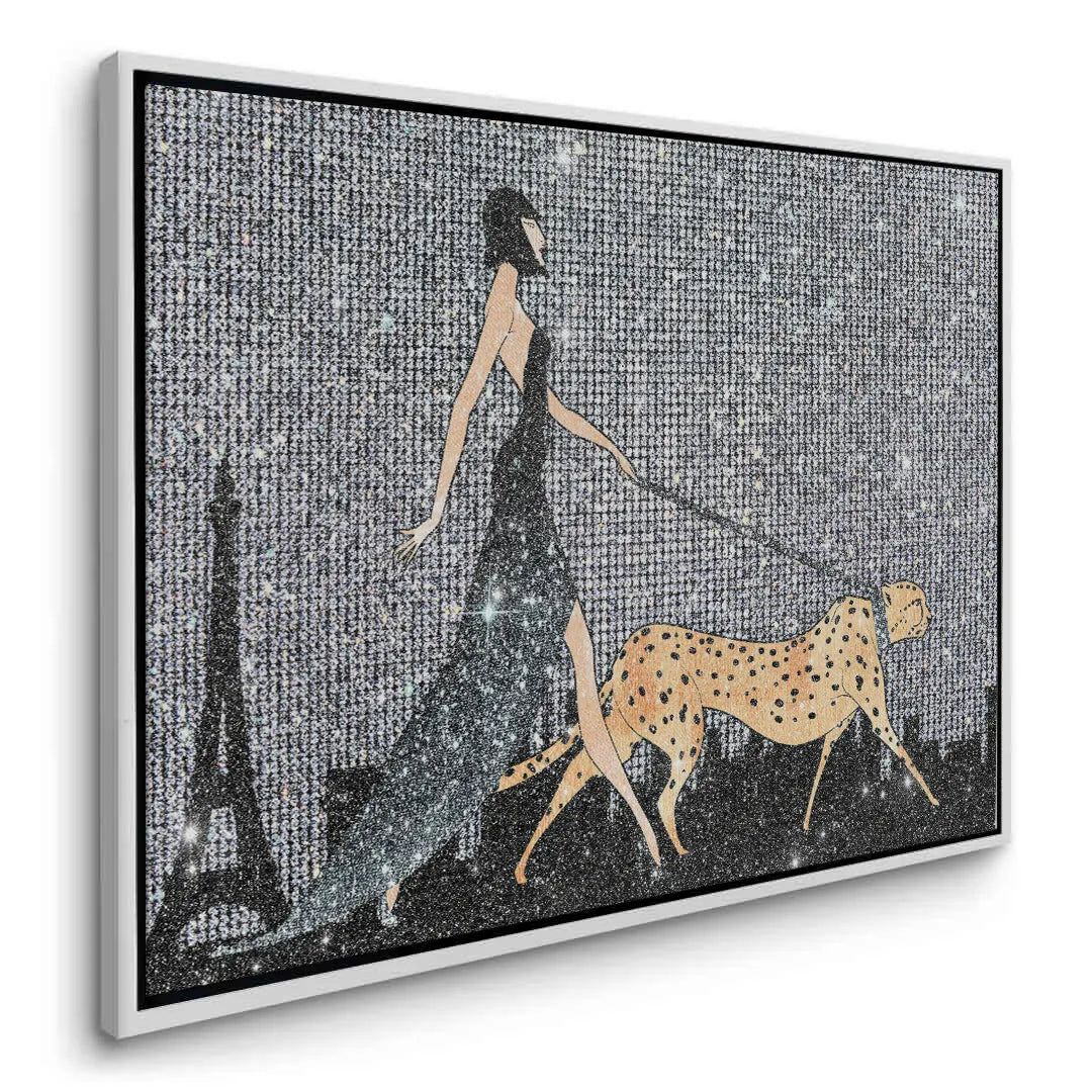 2Artful angle of the framed canvas depicting a glamorous woman and cheetah in a white frame.