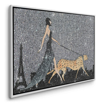 Artful angle of the framed canvas depicting a glamorous woman and cheetah in a white frame.