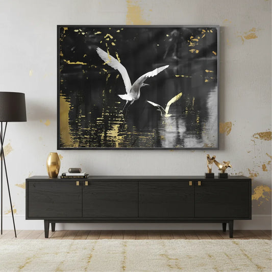Black framed Fine Art Print of the golden hummingbird displayed in a dark, sophisticated modern living room.