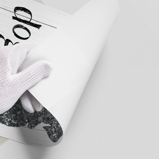 Close-up of a hand in a white glove peeling back the corner of the glitter dog poster.