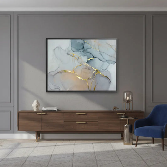 Abstract ink canvas print on wall above TV console in modern living room, gray and gold fluid art