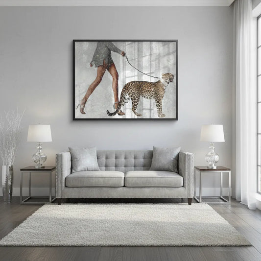 Large Acrylic wall art of woman walking leopard hanging above a white sofa in a modern, bright living room