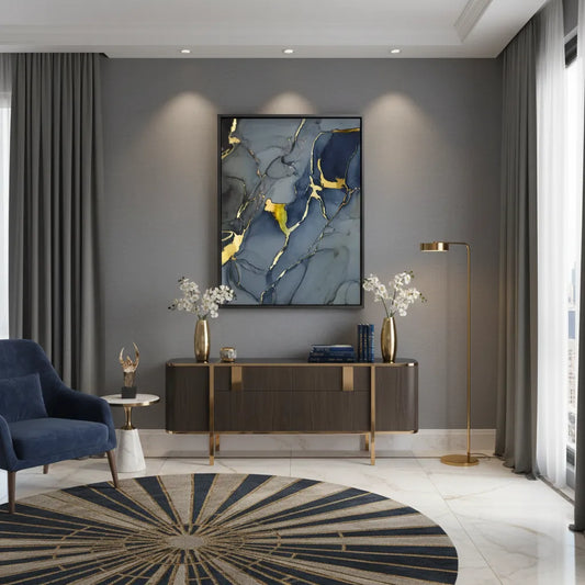 Elegant living room with a large grey, navy blue, and gold abstract canvas art above a console table UAE Dubai.