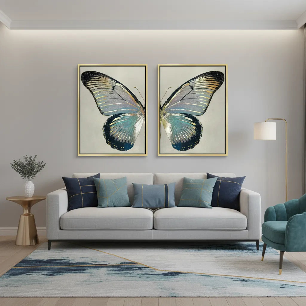 2Large butterfly canvas set in gold frames over modern grey sofa