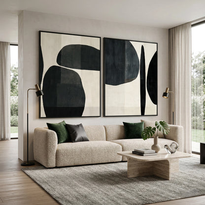 Minimalist 'Monochrome Organic Shapes' diptych with heavy hand-sculpted textures and soft shadow play, bringing architectural balance to a contemporary Abu Dhabi home.