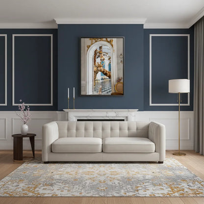 Luxury navy blue and gold room with the framed giraffe and meerkat canvas art above a white sofa.
