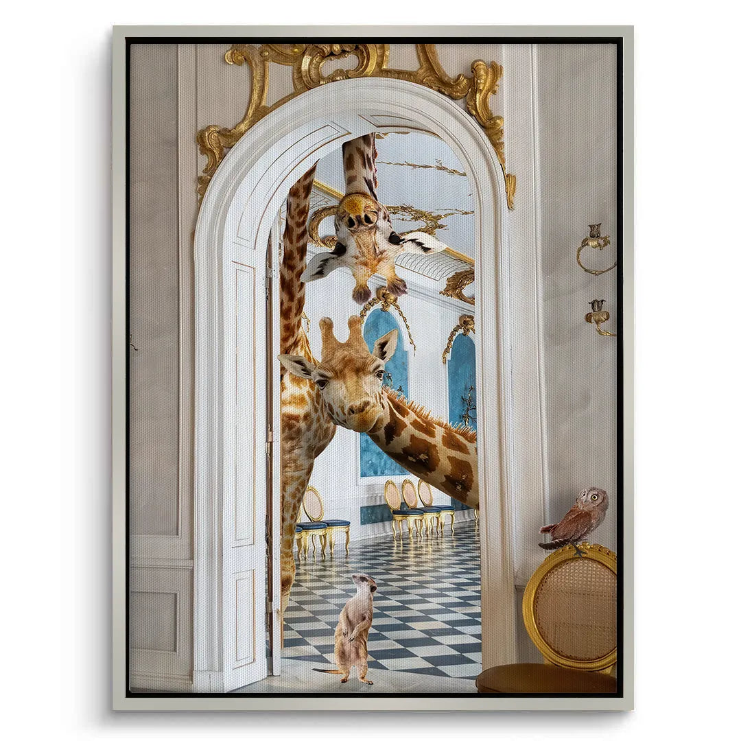 White-framed canvas print of the two giraffes and meerkat peeking through the ornate palace doorway.