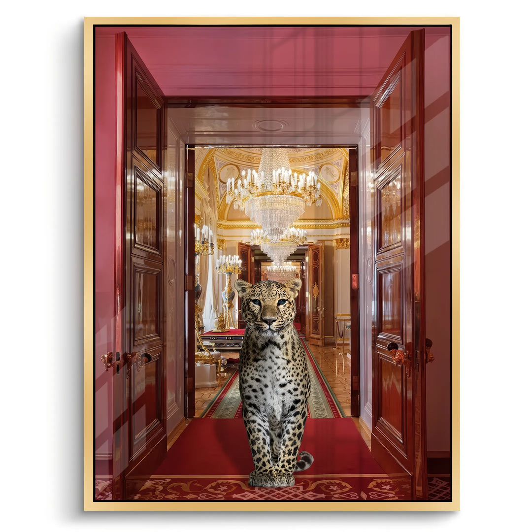 Rectangular acrylic wall art of a leopard on a red carpet in a palace, framed in a metallic gold finish.