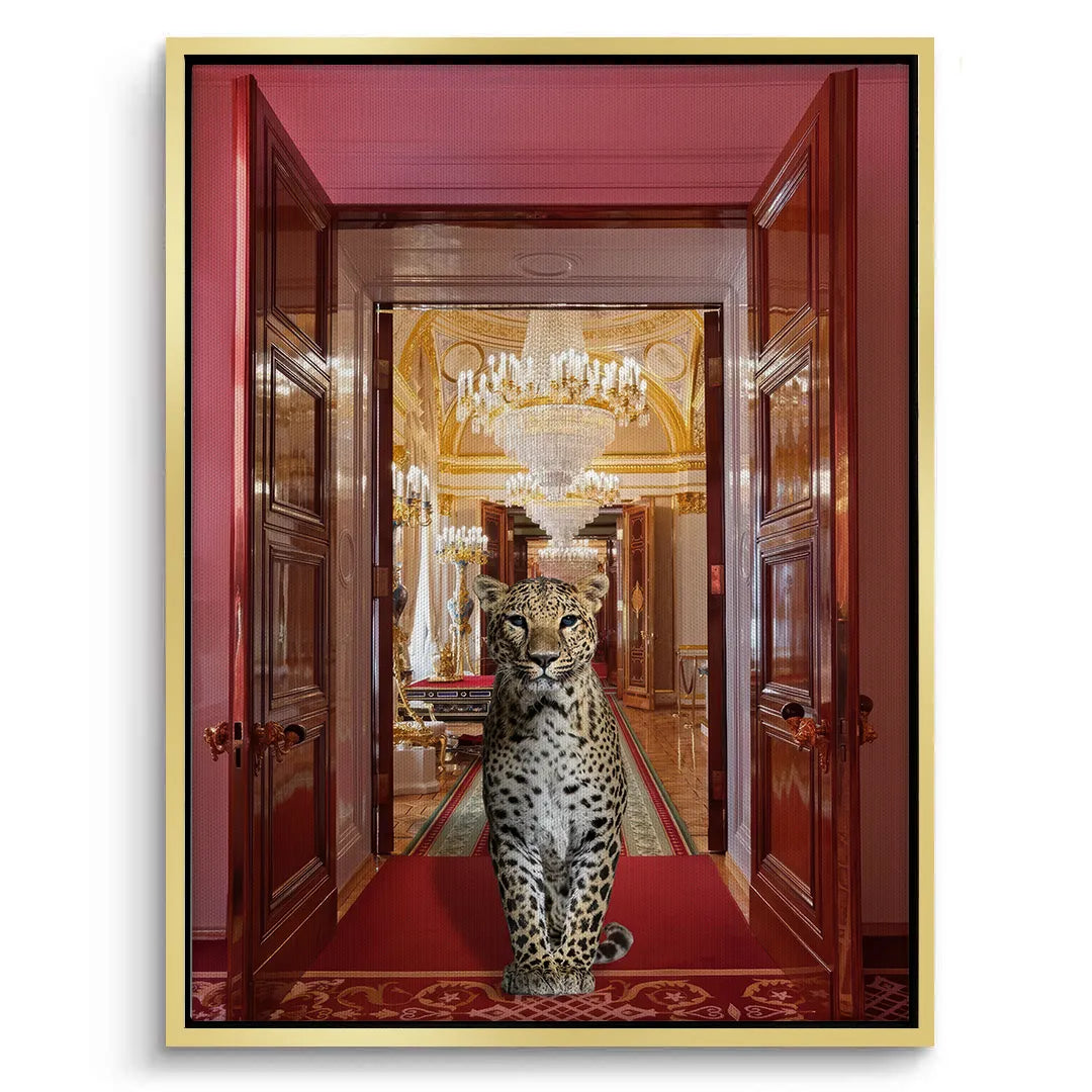 Gold-framed canvas print of the leopard on a red palace carpet with open doors leading to a gilded interior.