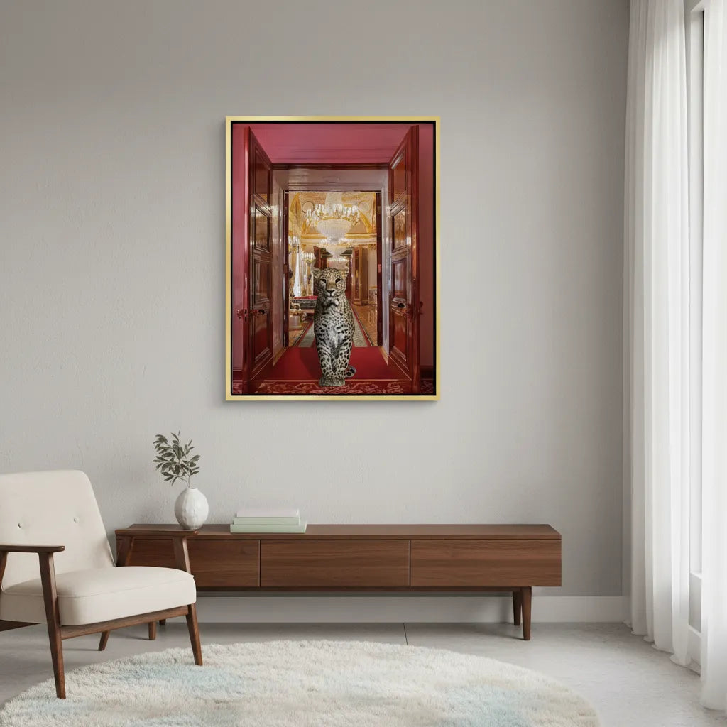 Cozy reading nook with a chair and the gold-framed leopard canvas print above a dark cabinet.