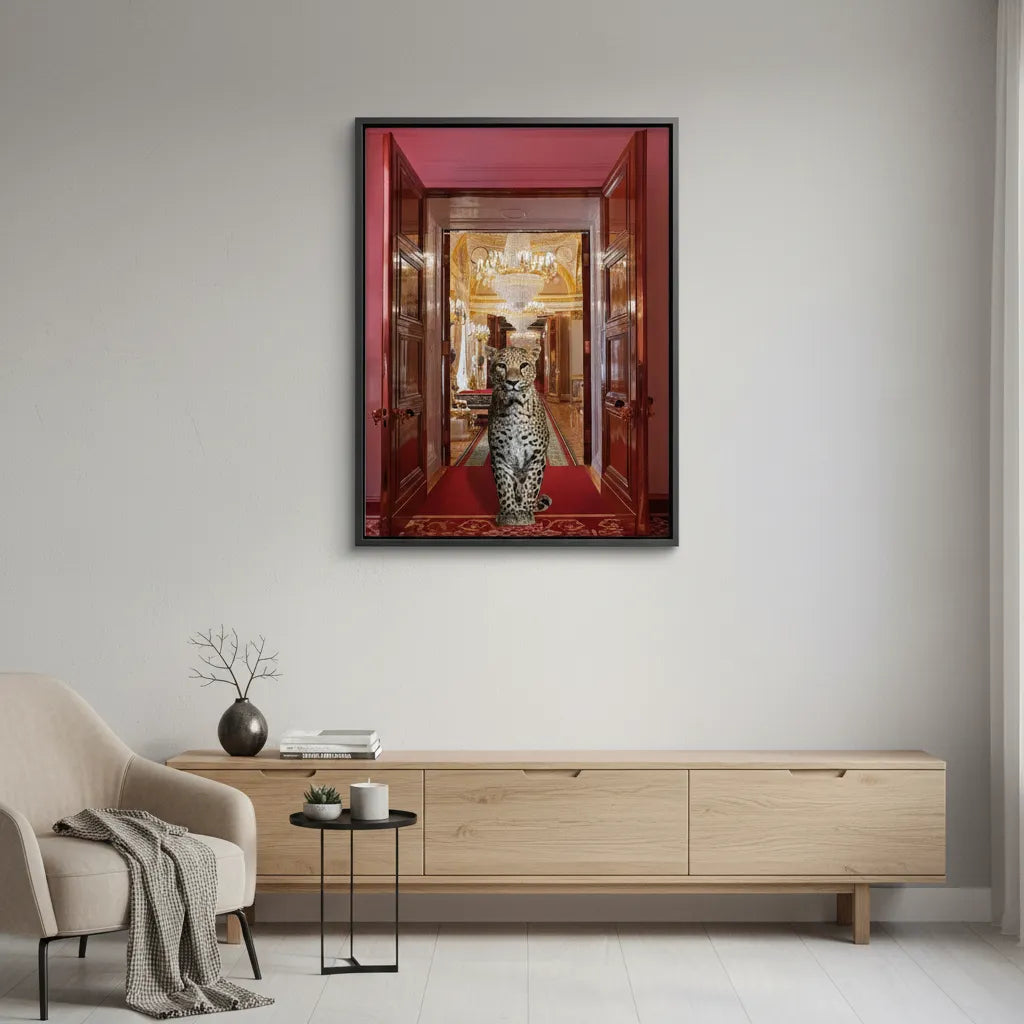 2Minimalist white room decor with the framed leopard in palace canvas print above a light wood console.
