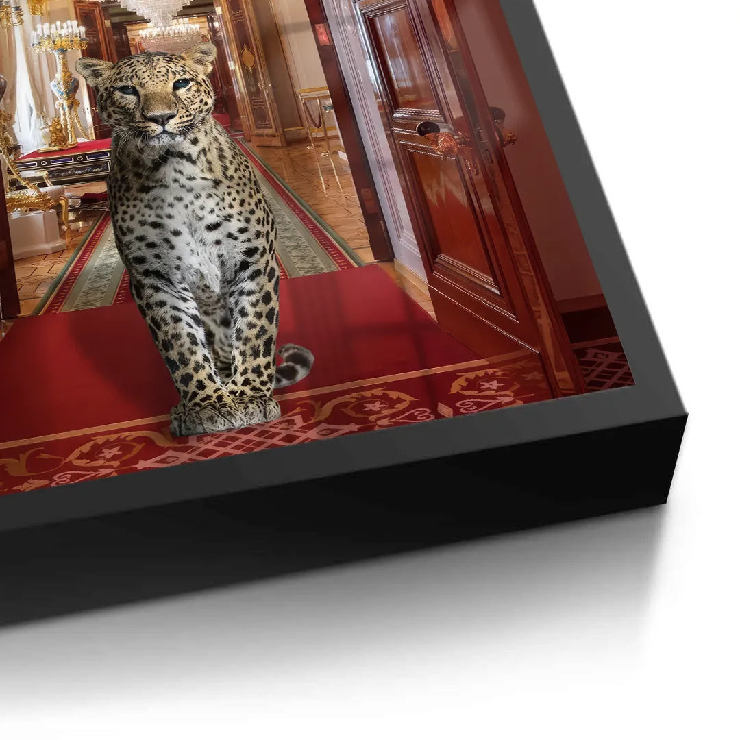 Detailed close-up of the leopard on the red rug, showing the texture of the fine art print and the black frame edge.