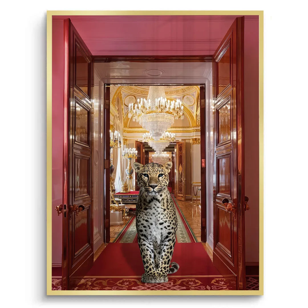 Fine art print of a leopard on a red carpet in a palace, framed in a sleek metallic gold.