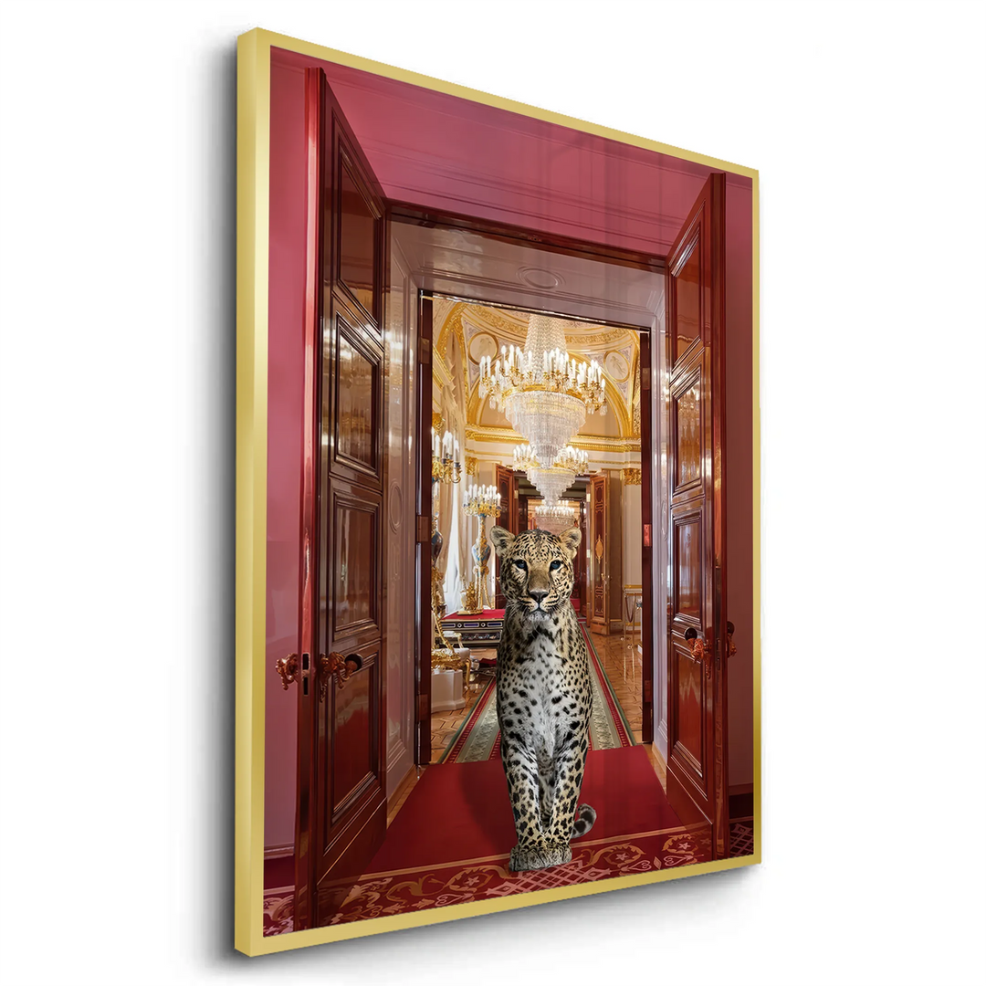 Angled perspective of the gold-framed fine art print of the leopard between red palace doors.