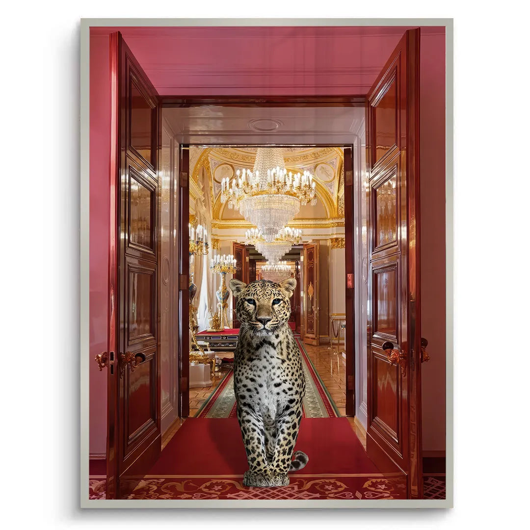 white framed fine art print with Leopard standing in a grand hallway with chandeliers and red carpet 