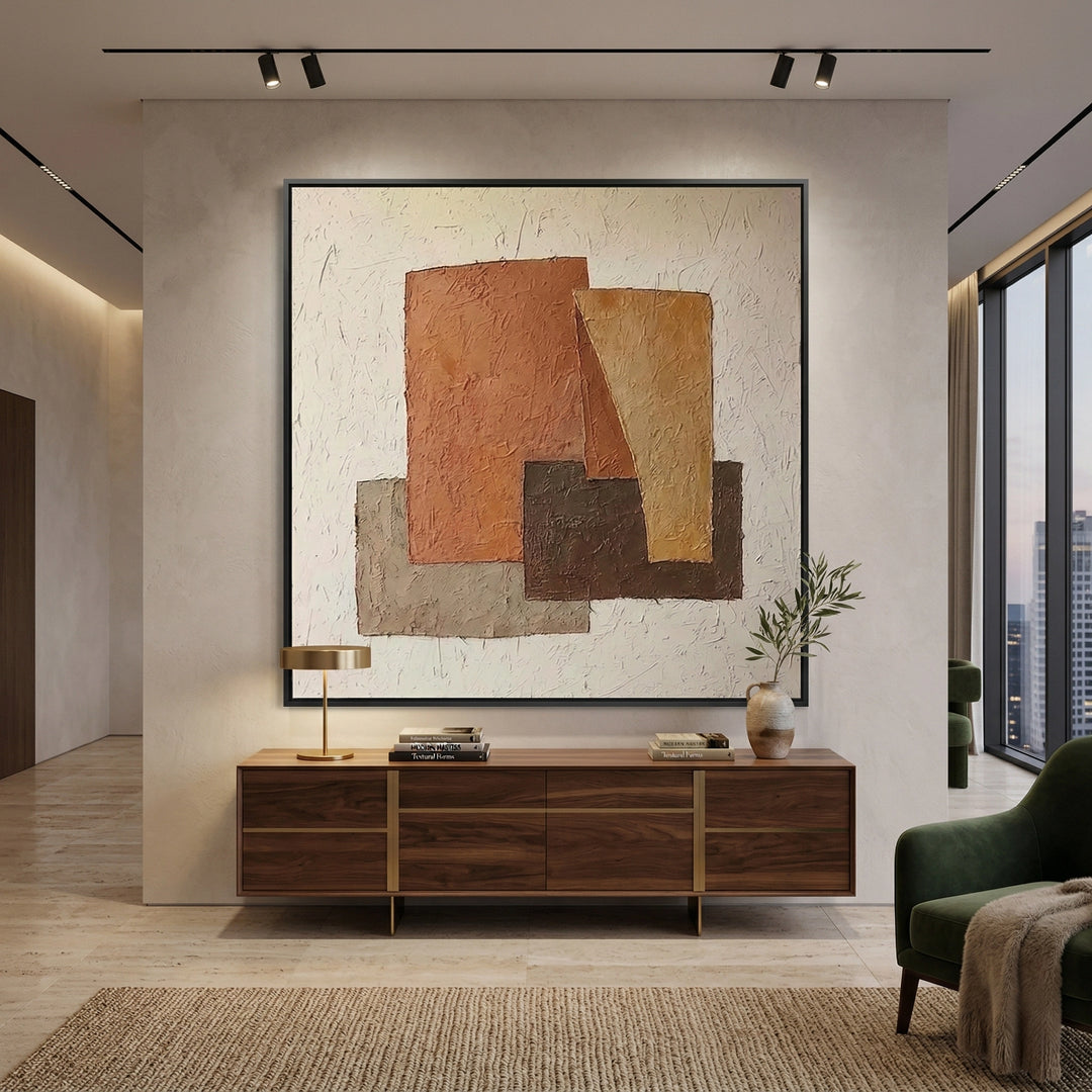 Handwoven wool rug with a rustic geometry pattern in sand and charcoal, bringing a modern tribal feel to a Dubai living room.