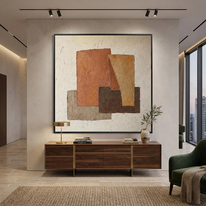 Handwoven wool rug with a rustic geometry pattern in sand and charcoal, bringing a modern tribal feel to a Dubai living room.
