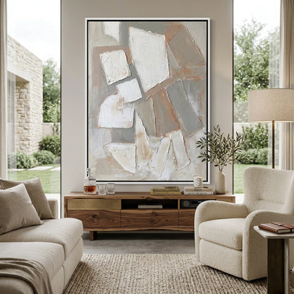Minimalist 'Stone Mosaic' canvas art with heavy impasto geometric tiles and deep shadow play, bringing a grounded 'Desert Modern' aesthetic to a contemporary Abu Dhabi villa.