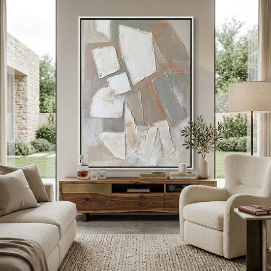 Minimalist 'Stone Mosaic' canvas art with heavy impasto geometric tiles and deep shadow play, bringing a grounded 'Desert Modern' aesthetic to a contemporary Abu Dhabi villa.