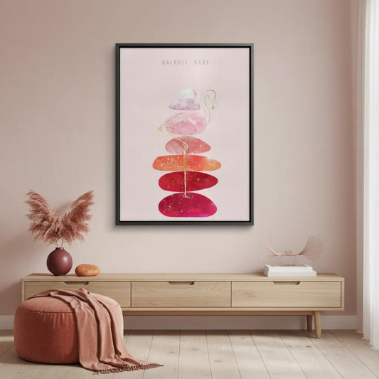 'Balance, Baby' canvas print with a black frame, hanging in a modern, pink-toned room.