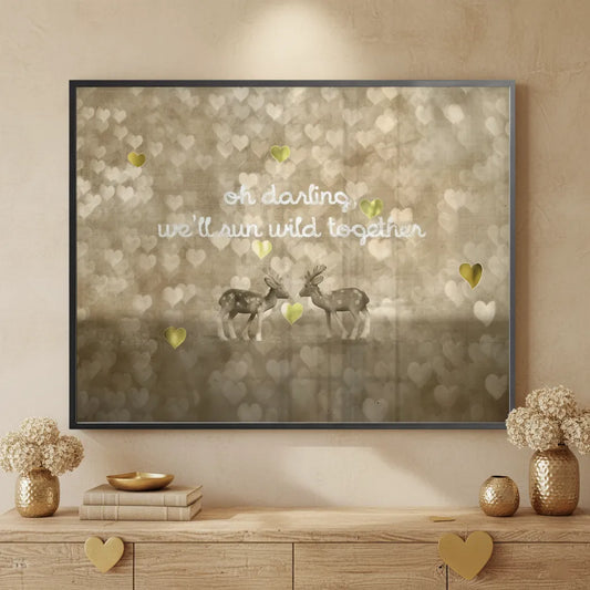 Framed Fine Art quote print with deer and hearts above a wooden credenza in a minimalist, warm-toned room