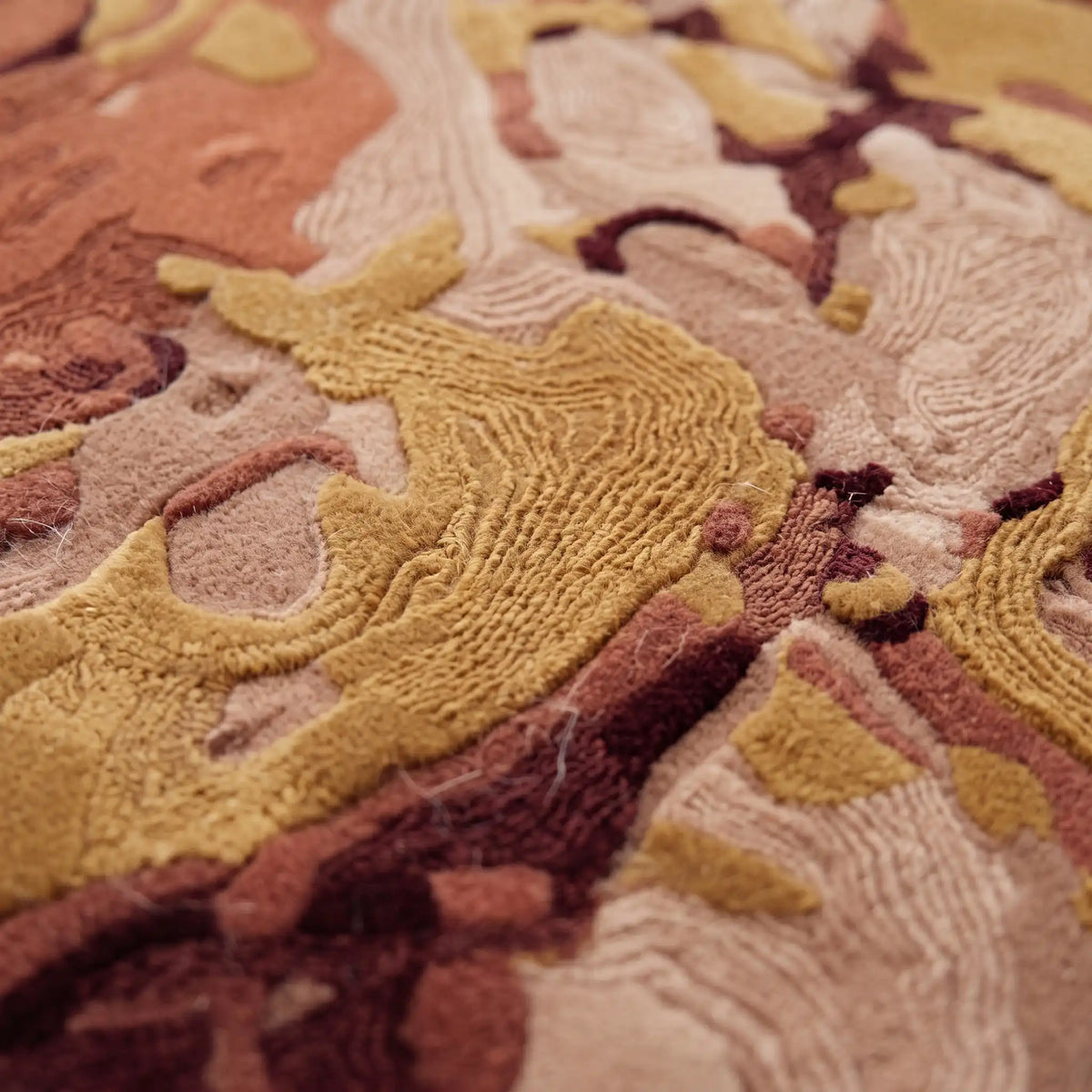 Terrain Bloom modern abstract rug in Saffron Rose – close-up of the tufted pile texture
