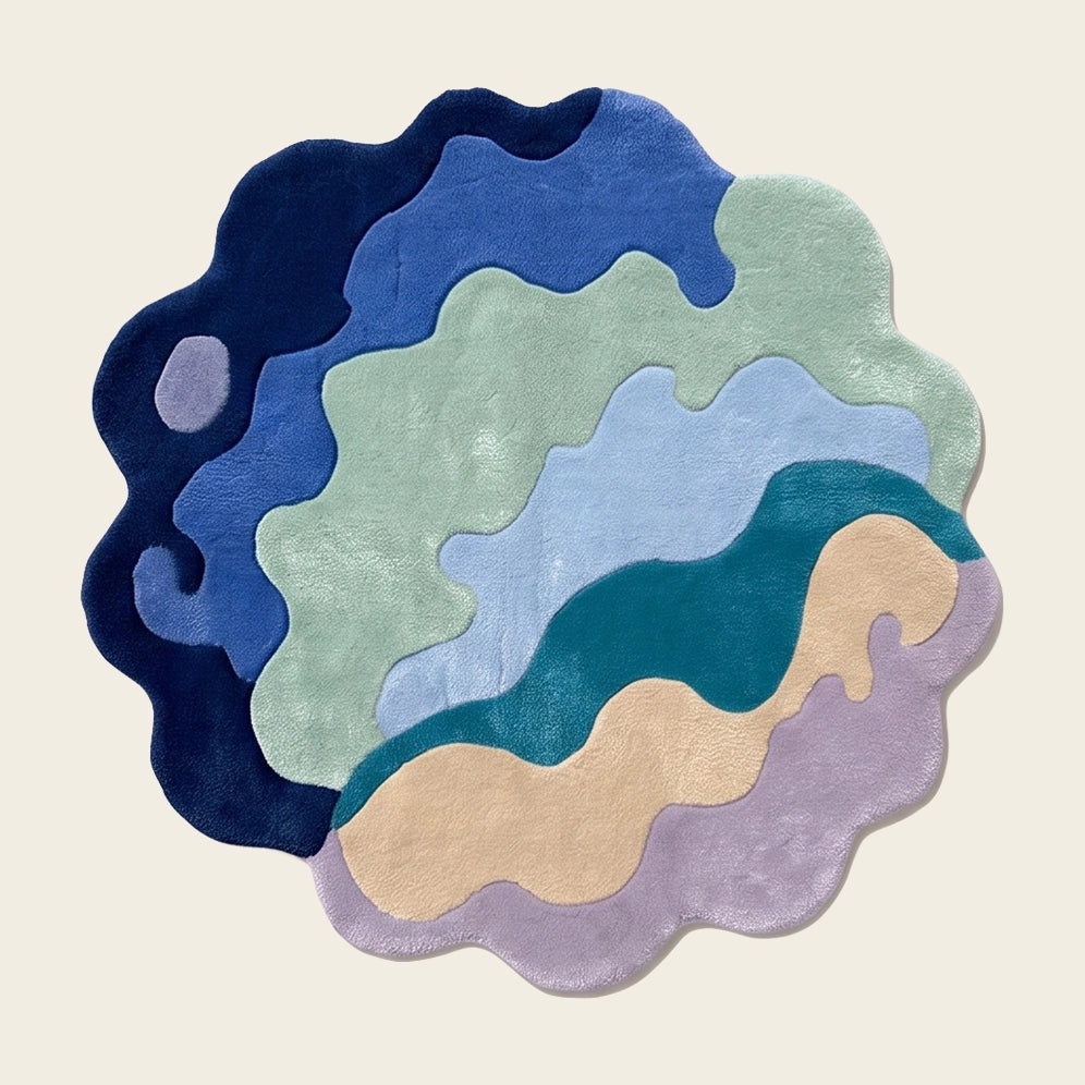 Wave Bloom hand-tufted rug in Ocean Blue – flat lay