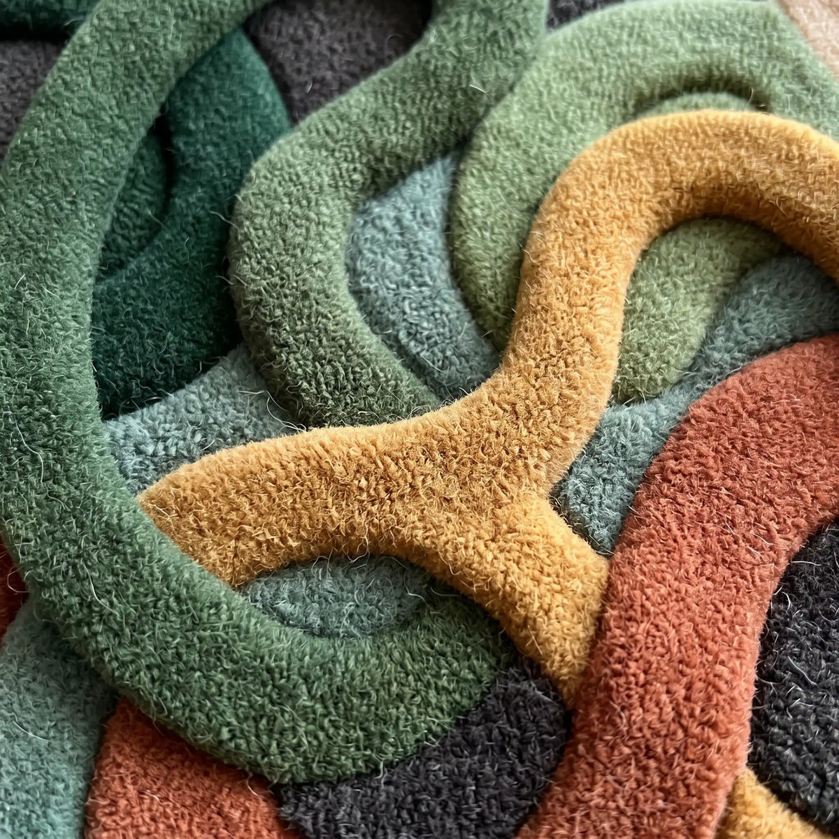 Infinite Loops modern abstract rug in Autumn Forest – close-up of the tufted pile texture