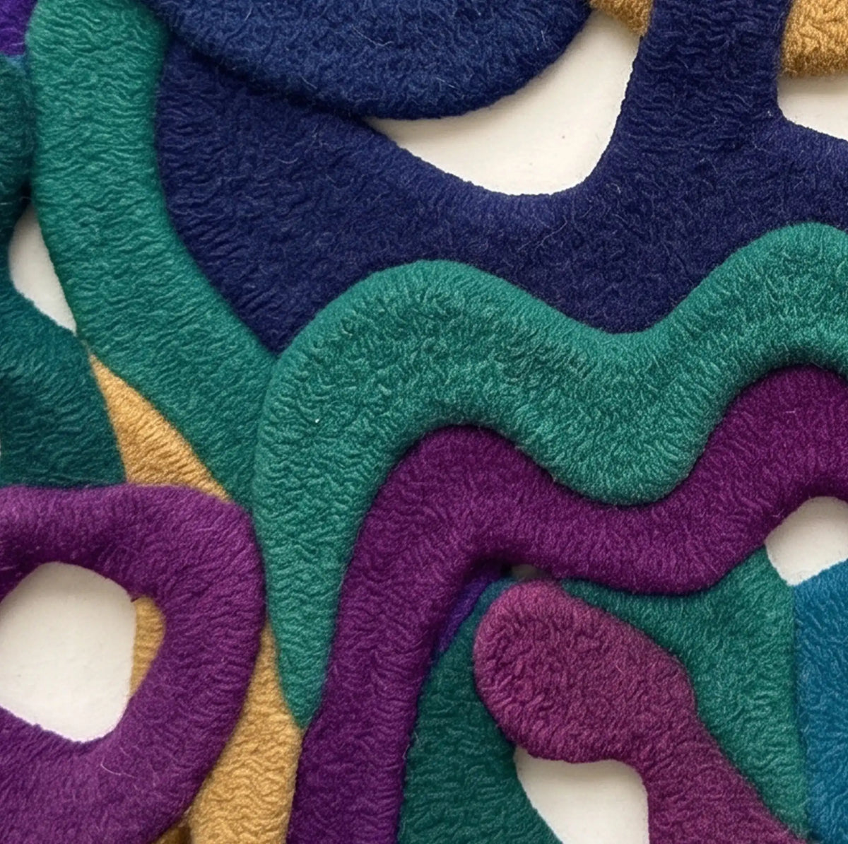 Infinite Loops modern abstract rug in Jewel Tones – close-up of the tufted pile texture