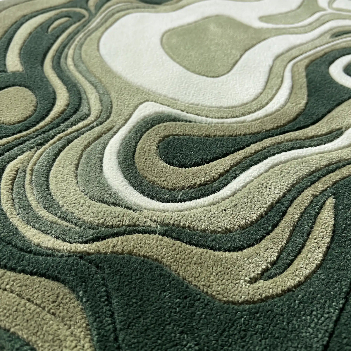 Agate Flow hand-tufted rug in Forest Sage – close-up of the tufted pile texture
