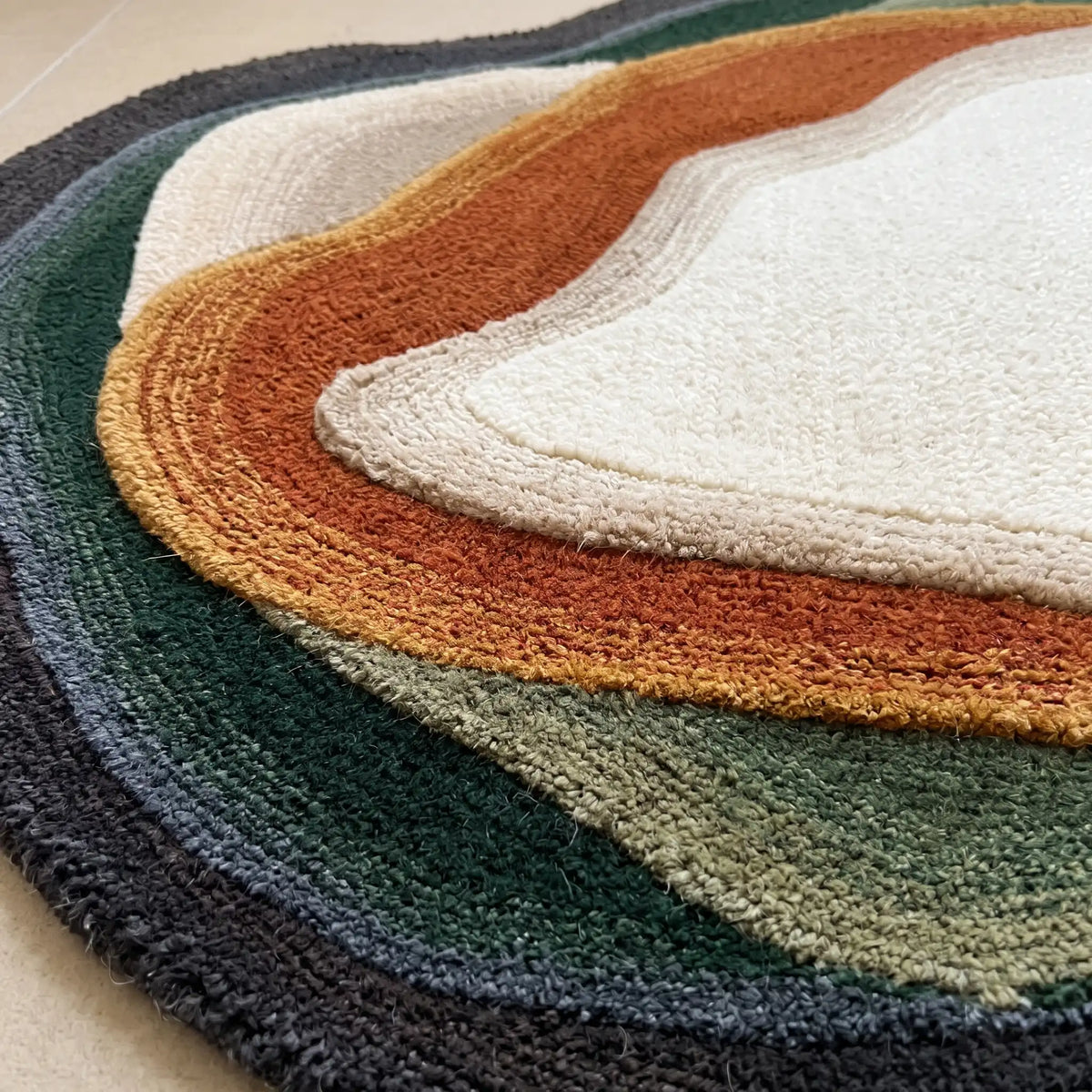 Stone Pool hand-tufted rug in Forest Ember – close-up of the tufted pile texture