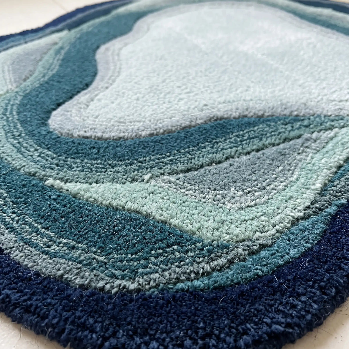 Stone Pool hand-tufted rug in Navy Mist – close-up of the tufted pile texture