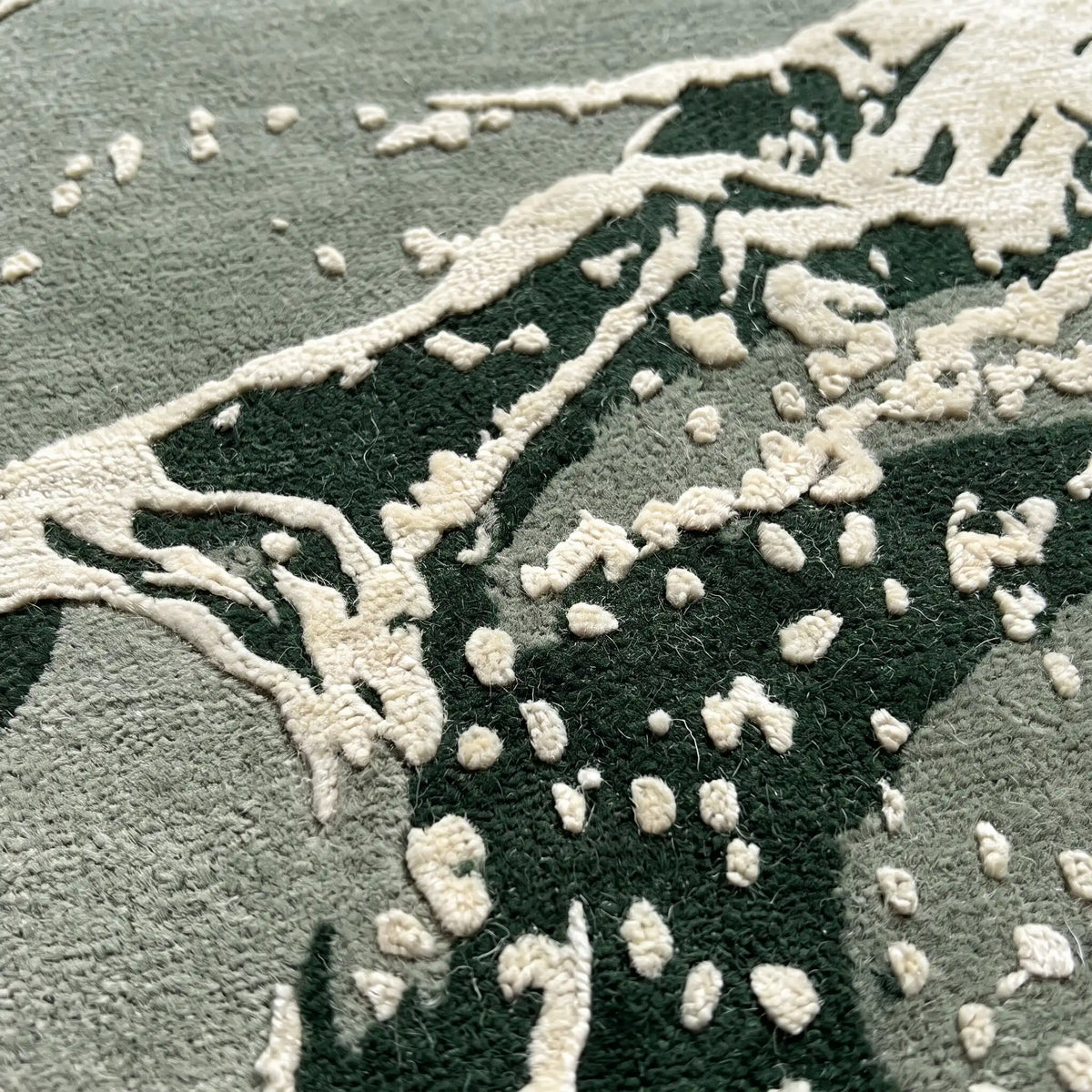 Stone Atlas hand-tufted rug in Moss Green – close-up of the tufted pile texture