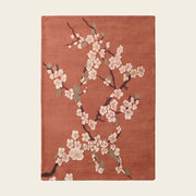 Sakura Branch hand-tufted rug in Terracotta – flat lay
