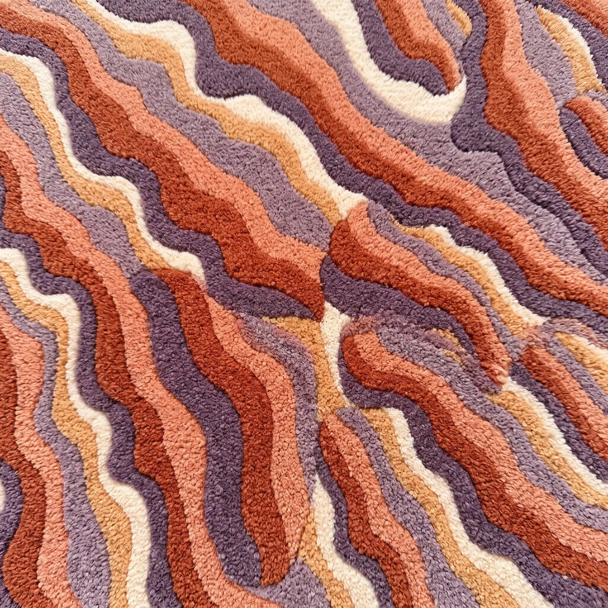 Ripple Dune hand-tufted rug in Coral Peach – close-up of the tufted pile texture