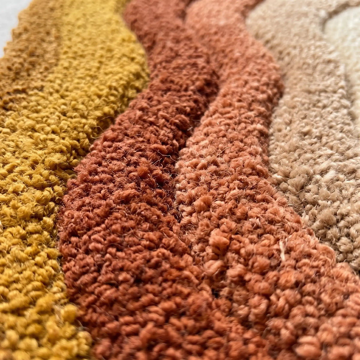 Echo Pool modern abstract rug in Saffron Peach – close-up of the tufted pile texture