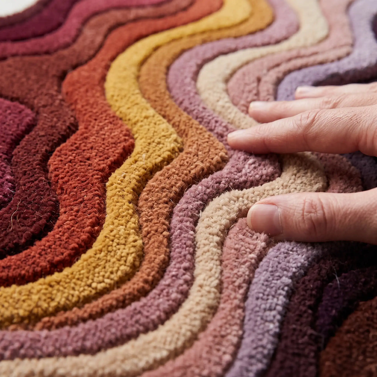 Canyon Waves modern abstract rug in Burgundy Spice – close-up of the tufted pile texture