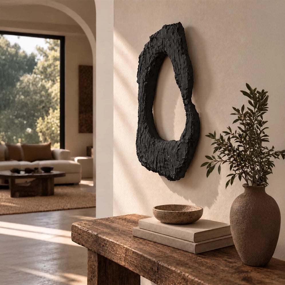 Dune Halo Textured Sculptural Wall Art – Charcoal Black – styled in a living room